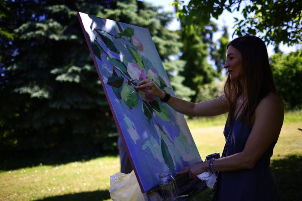 Elena Wuest at work on a large canvas