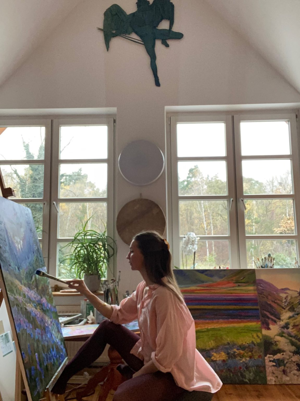Elena Wuest painting in her studio in Berlin